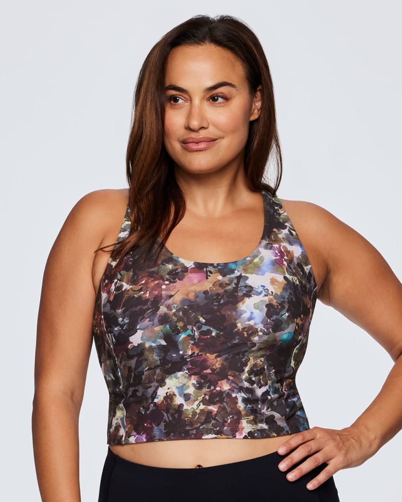 Front of a model wearing a size 1X Botanical Floral Shelf Bra Tank in Multi by RBX Active. | dia_product_style_image_id:244572